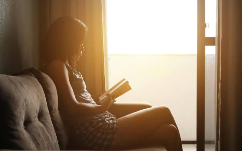 person sitting peacefully in morning sunlight morning habits that change your life