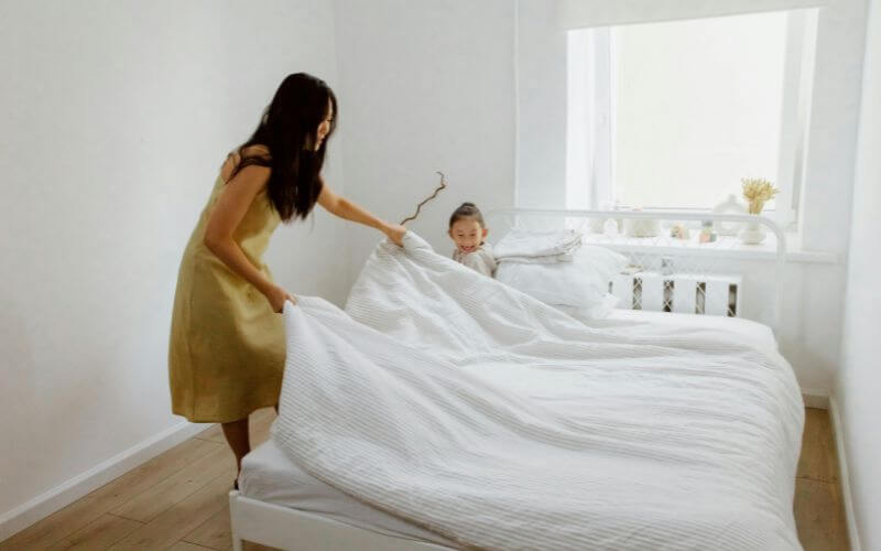 woman practicing morning gratitude with hands open feeling thankful and calm