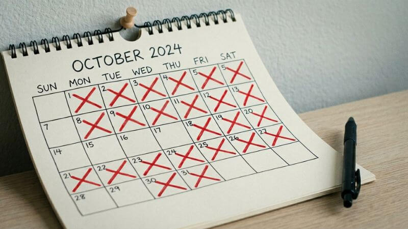 wall calendar with red X marks tracking daily habits that change your life one day at a time
