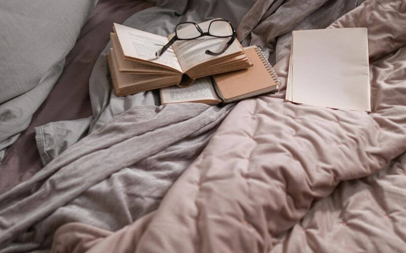 introvert reading and writing in a quiet cozy corner practicing silent daily growth habits