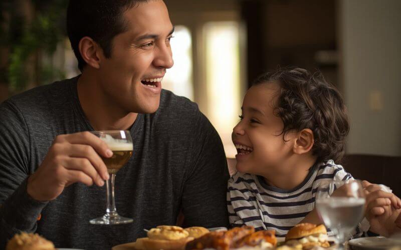 parent and child laughing together at breakfast table showing the joy of respectful parenting tips daily