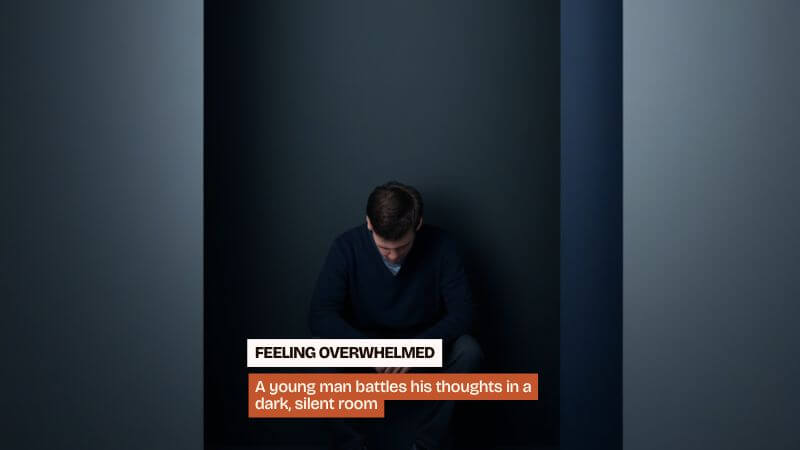 man sitting alone in dark room feeling stuck before learning to accept yourself and move forward